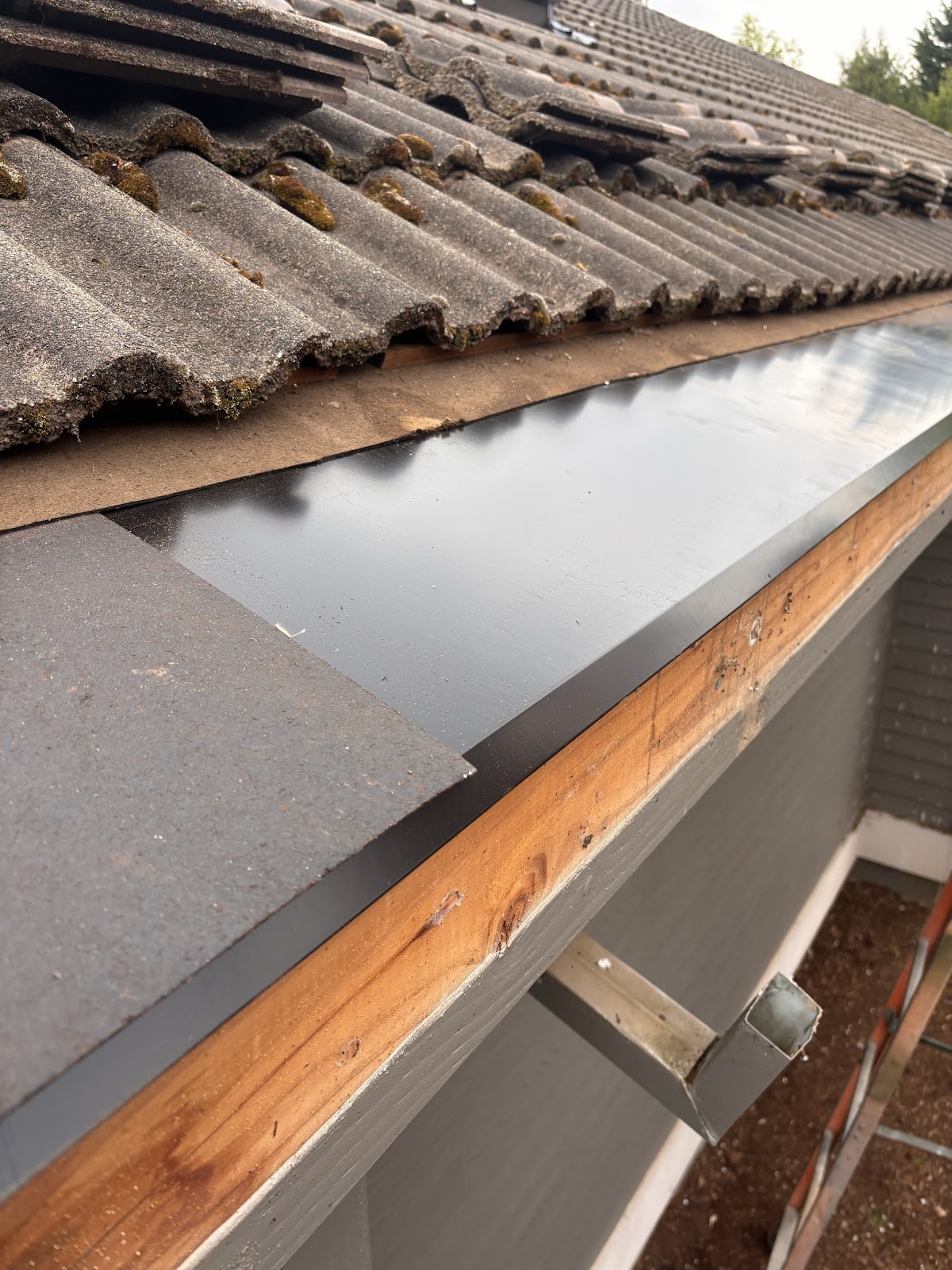Completed shingle roofing work